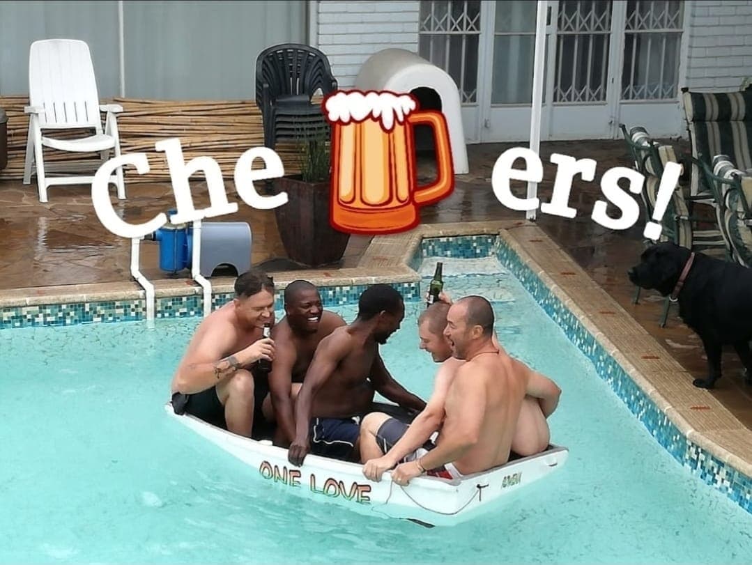 The Splash Plumbers team celebrating in a pool after a job