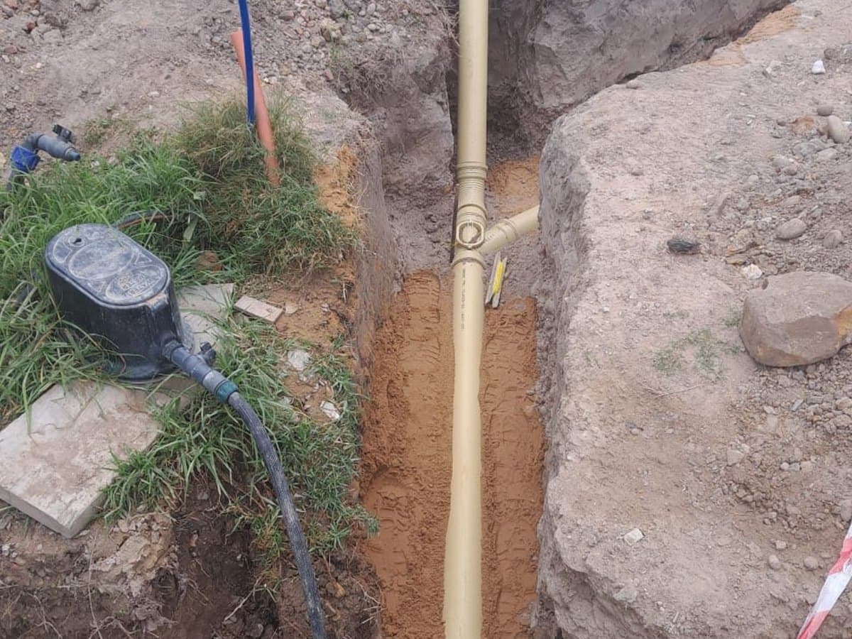Drain line repair with water running in the trench