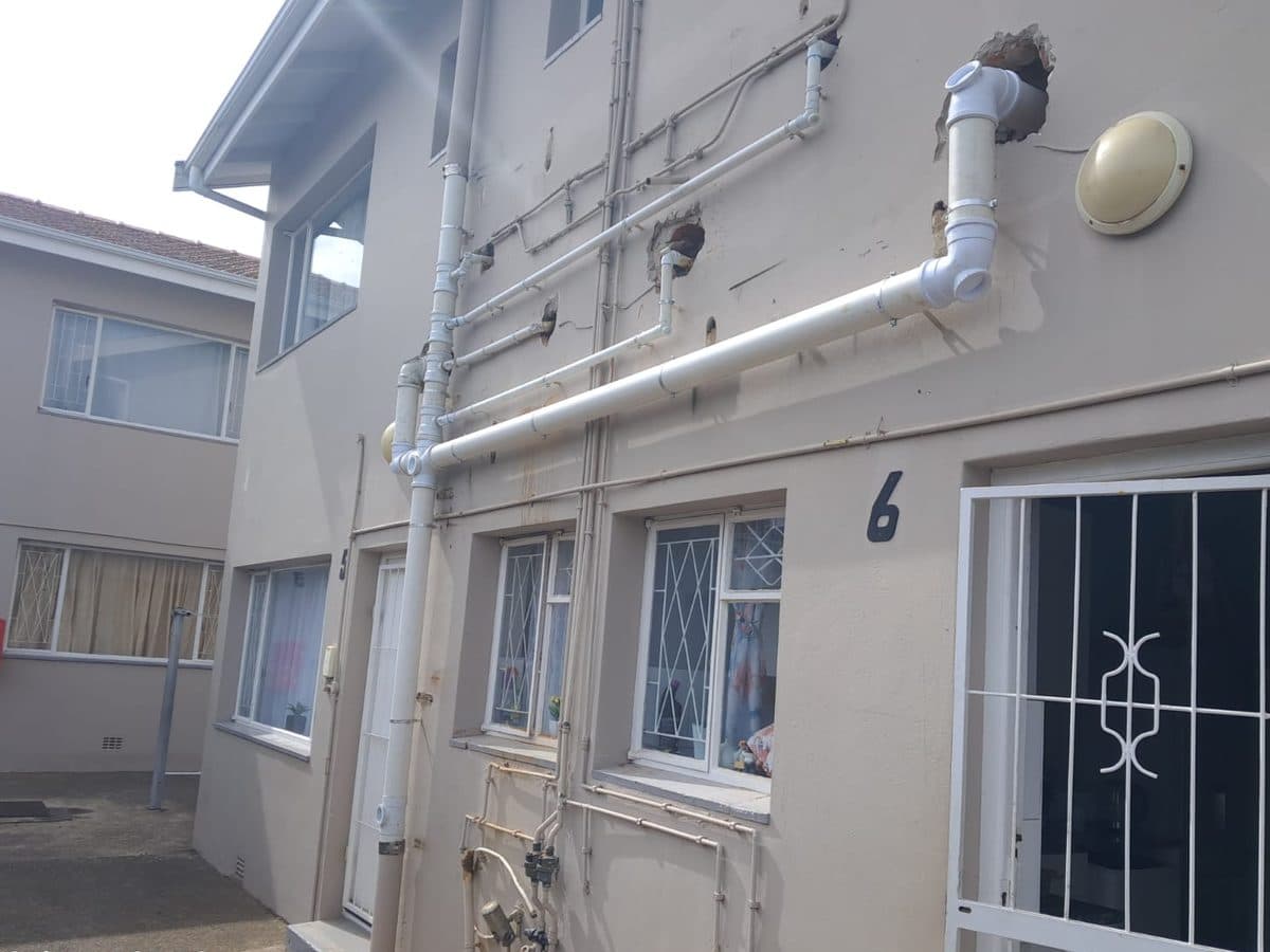 New external pipework and a drain at a house