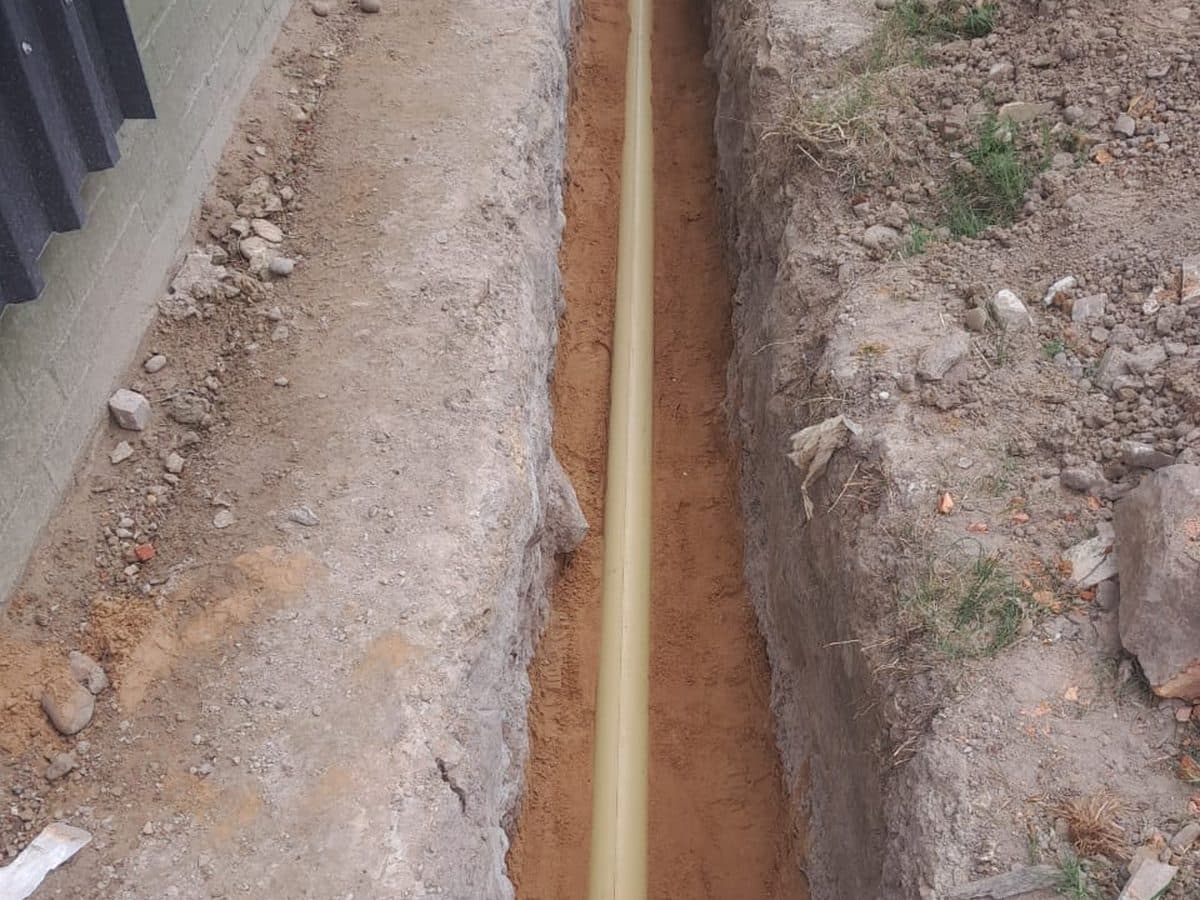Open drain trench at a residential property