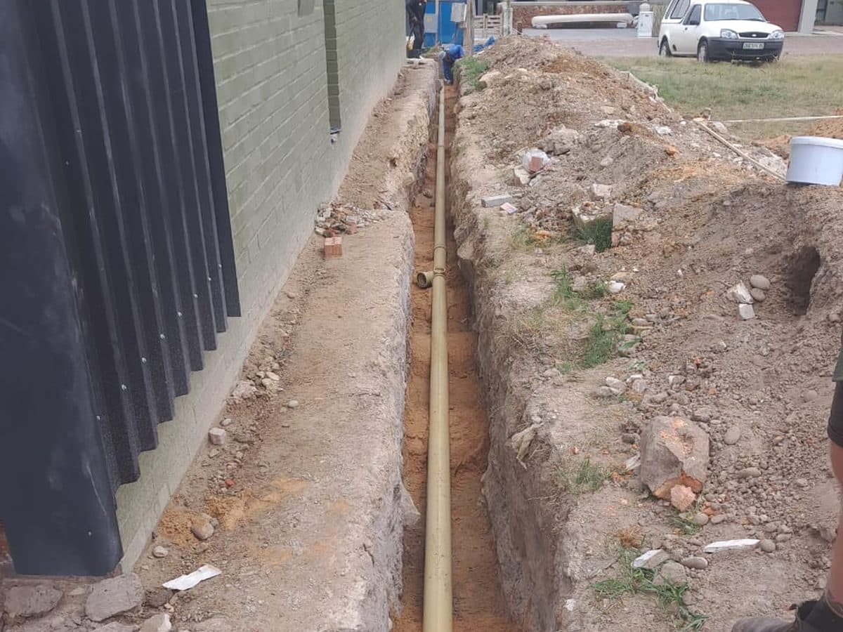Drain trench running along a fence line