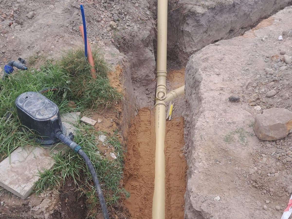 Drain pipe and jetting hose in a trench