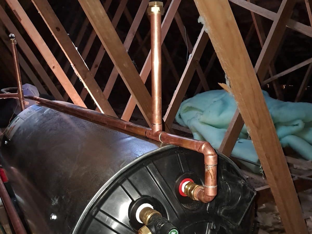 Geyser and copper pipework between roof trusses