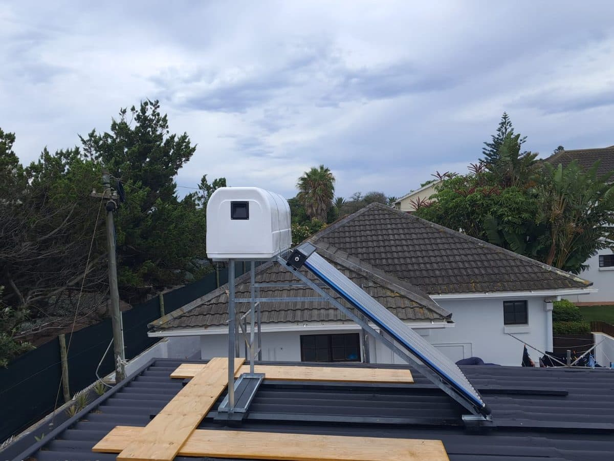 Flat-panel solar geyser installed on a tiled roof