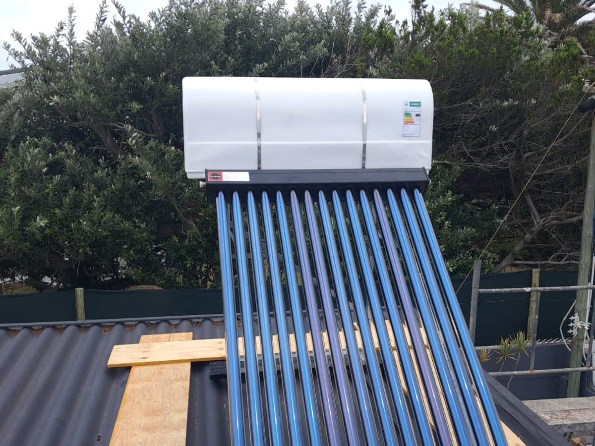 Solar geyser collector tubes and tank fitted on a roof