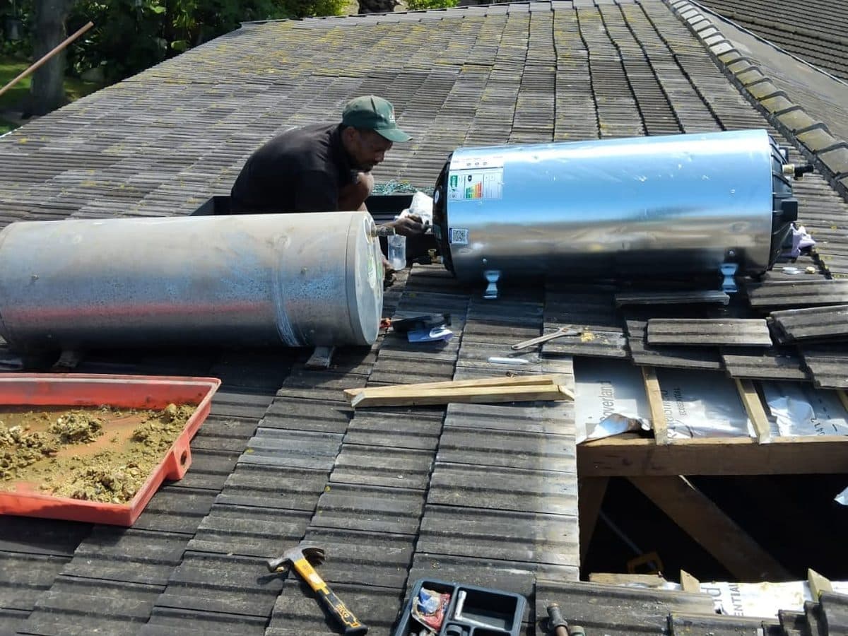 Geyser cylinders being installed on a roof
