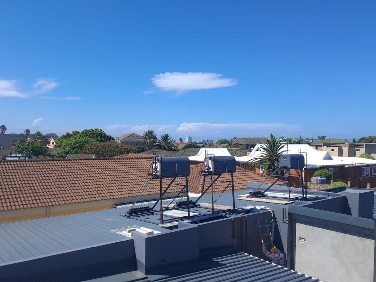 Solar geysers and panels across a block of flats