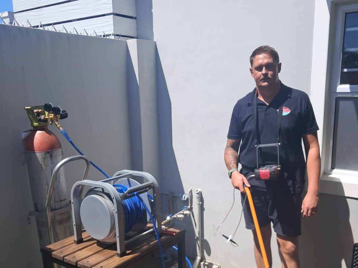 Splash Plumbers technician with the leak detection gear