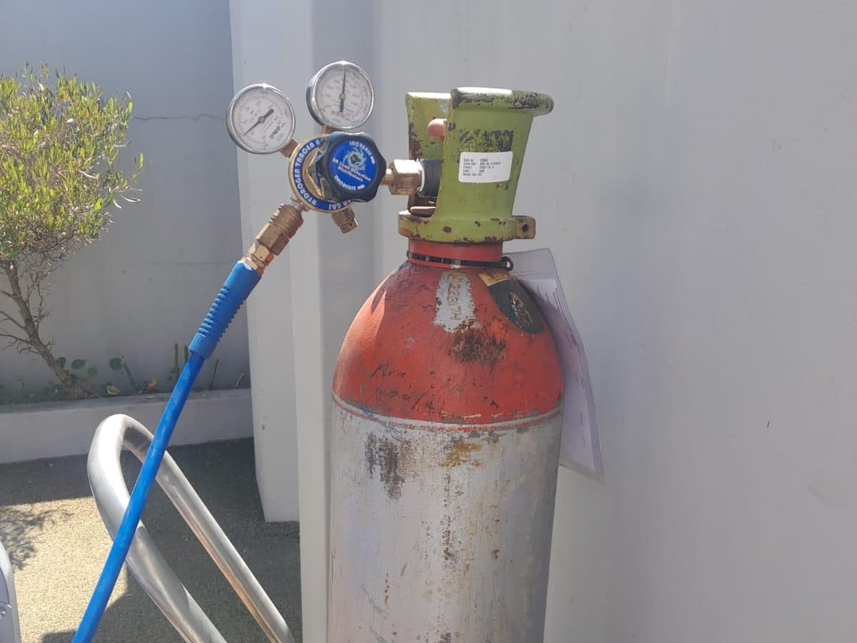 Leak detection cylinder connected to a water line
