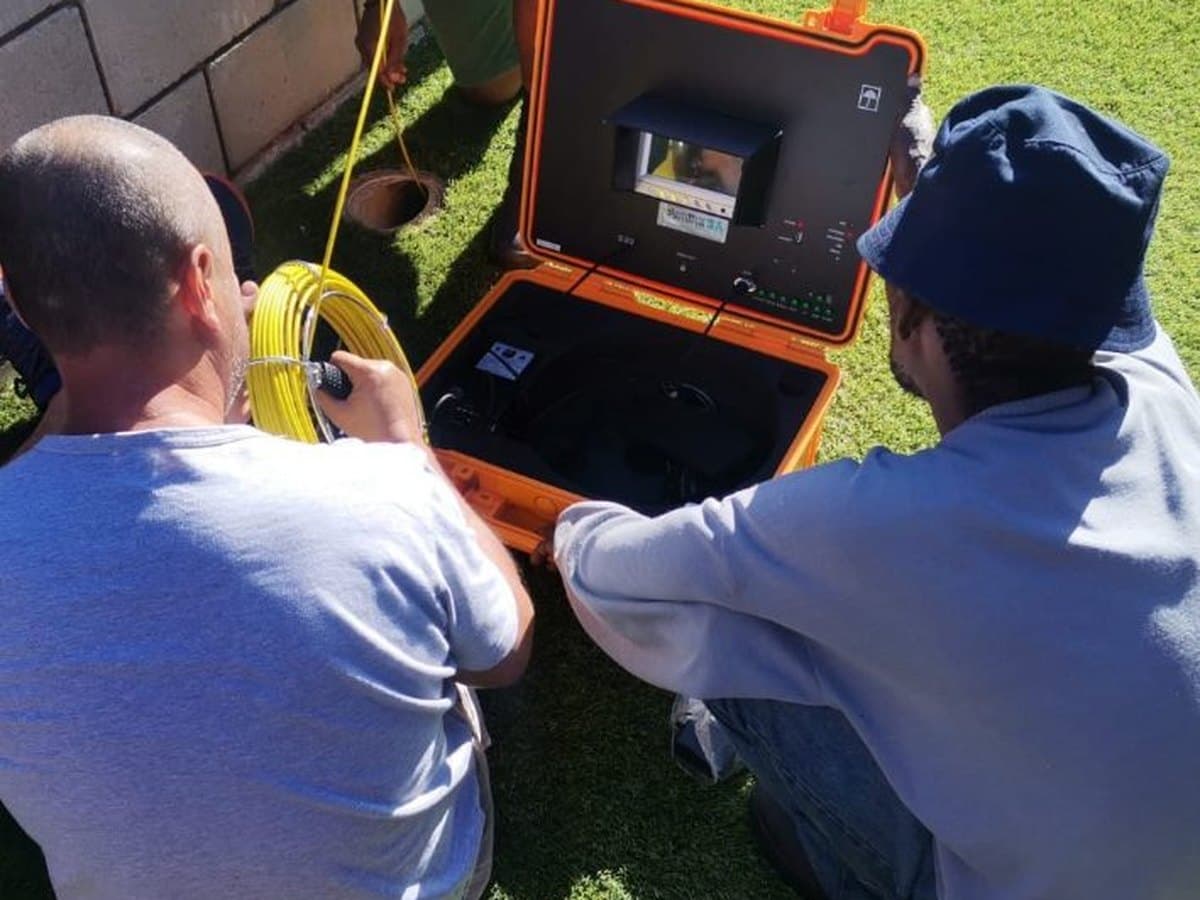 Splash Plumbers crew setting up leak detection equipment on site