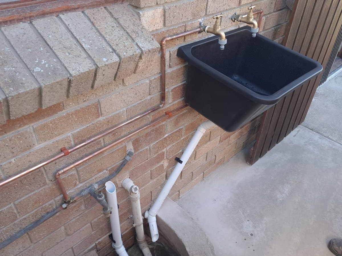 Outdoor laundry sink installed