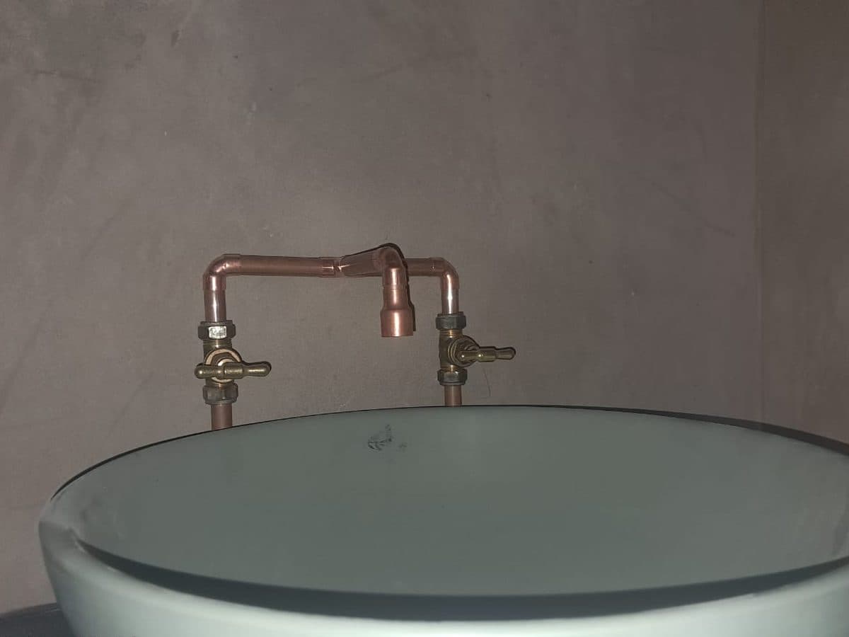 Round basin with brass tapware fitted during a bathroom renovation in Gqeberha