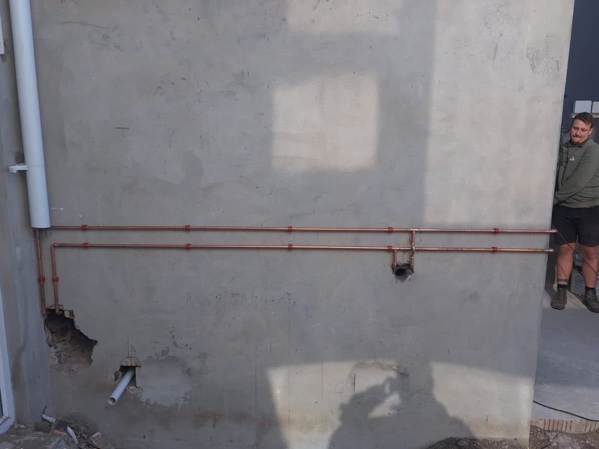 Copper pipework on an external wall