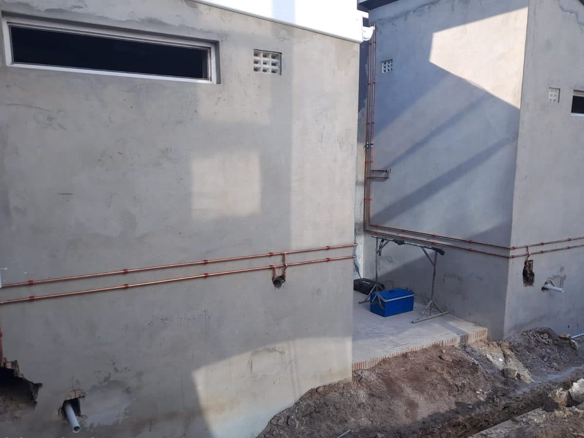 External pipework on a newly built wall
