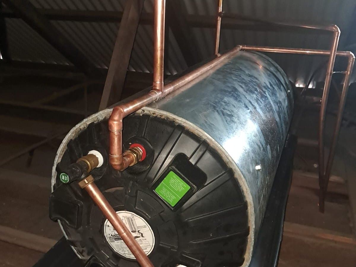 Copper geyser cylinder installed in a roof space